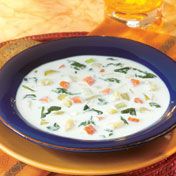 Potatoes get punched up with lots of flavorful vegetables in this quick-cooking, creamy soup that's sure to keep them coming back for more.