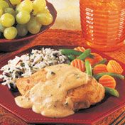 This quick cooking dish features seasoned browned chicken breasts cloaked in a smooth sauce made with sour cream, green onion and cream of chicken soup.