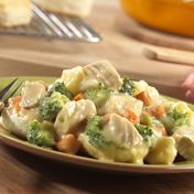 This simply delicious skillet dish features a tasty combination of cooked chicken, mixed vegetables and Campbell's Condensed Cream of Chicken Soup, heated together and served over hot biscuits.