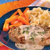 Seasoned, browned pork chops simmered in a creamy mustard-laced sauce  - it may sound complicated, but you'll be surprised how quick, easy and delicious it really is.