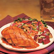 Chicken on the grill is basted with a honey-and-mustard kissed tomato sauce.