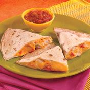 In the mood for a little Southwestern food?  Then try these zesty chicken quesadillas that use prepared salsa and canned soup, so they're as easy to make as they are good.<br />
