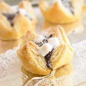 Delicious and fast-fix sweets with a trio of favorite flavors--chocolate, marshmallow and peanut butter--are so easy to bake when you start with puff pastry sheets.