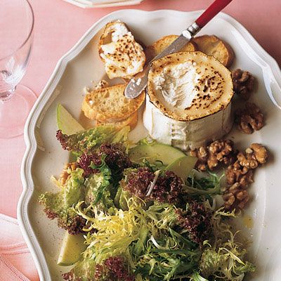 <p>This bistro-inspired first course of bitter greens, tart apple, and toasted walnuts is enhanced with bubbling Bucheron cheese and toasted baguette.</p><br /><p><b>Recipe: <a href="/recipefinder/frisee-green-apple-salad-goat-cheese-toasts-recipe">Frisée and Green-Apple Salad with Goat-Cheese Toasts</a> </b></p>