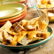 You can make restaurant-style chicken nachos at home using this simple recipe...and it only takes 15 minutes!