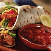 Fresh Western flavors of Pace{{{reg}}} Picante Sauce, lime juice and chili powder season strips of chicken to fold inside a tortilla with crisp lettuce, shredded cheese and chopped tomato.