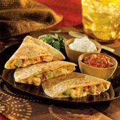 Your favorite restaurant-style quesadillas can be easily made at home with this fabulous recipe featuring salsa con queso, chicken red pepper and guacamole that comes together in just 15 minutes.