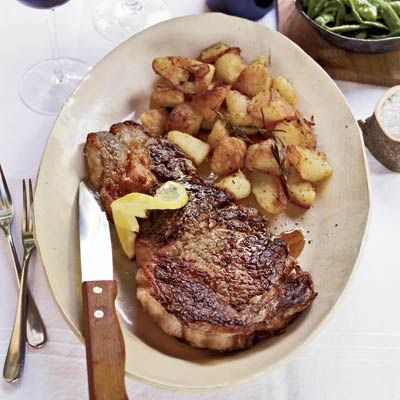 <p>The rib-eyes shine here but it's the potatoes that take center stage. Parboiled, then roasted with rosemary and olive oil until they become crispy on the outside, there is nothing for them to do but steal the show! Don't worry, inside they're light, fluffy, and buttery.</p><p><b>Recipe: </b><a href="/recipefinder/grilled-rib-eye-steaks-roasted-rosemary-potatoes-recipe-fw1010" target="_blank"><b>Grilled Rib-Eye Steaks with Roasted Rosemary Potatoes</b></a></p>