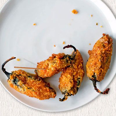 <p>Spicy jalapenos are stuffed with cheese, then rolled in cornmeal and deep-fried to make these addictive snacks.</p><br /> <p><b>Recipe:</b> <a href="/recipefinder/jalapeno-poppers-recipe-opr0211" target="_blank"><b>Jalapeño Poppers</b></a></p>