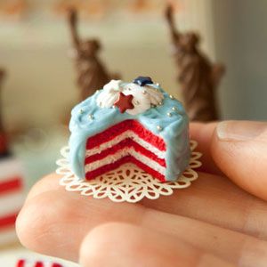 <b>The Artist:</b> Caroline McFarlane-Watts, <a href="http://hummingbirdminiatures.blogspot.com/" target="_blank">Hummingbird Miniatures</a><br /><br />

This patriotic cake isn't edible (it's made out of polymer clay), but it sure looks good enough to eat. Miniature artist Caroline McFarlane-Watts started making and selling her mini creations to other kids on the playground when she was young. Today she has some decidedly bigger clients. Have you seen <i>Harry Potter and the Order of the Phoenix</i>? Then you've seen McFarlane-Watts' work. She created the scale model of Hogsmeade Village for the movie.<br /><br />

Want to purchase an original Hummingbird Miniature mini food? Check out this shop on <a href="http://www.etsy.com/shop/hummingbirdminiature" target="_blank">etsy.com</a>.