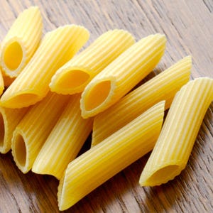 <p>Literally meaning "quills" in Italian, this substantial pasta's name describes its hollow, diagonal-cut shape, similar to an old fashioned pen tip. Penne comes smooth or ridged and is best served with meat, fish, or hearty vegetable mix-ins. It can also be baked in a casserole and is suitable for frying.</p><br />
<p><a href="/search/fast_search_recipes?search_term=penne"><b>Find recipes with penne</b></a></p>