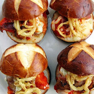 <p>Once the territory of greasy diners and fast food chains, "sliders" originally referred to thin mini-burgers in squishy potato buns. While purists can still find this classic version, America's obsession with haute comfort food has inspired chefs to adopt the term for any shrunken sandwich. Now, buzzy ingredients like pork belly or ahi tuna stand in for ground beef, and condiments might include miso aioli over ketchup or house-made kimchi in place of grilled onions.</p>