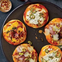 These luscious mini pizzas feature three variations of chicken-topped pies: barbecue, Buffalo wing, and cheddar-bacon. You can also make this pizza using our Whole Wheat or Thick Crust pizza doughs.
