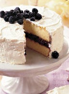 Just-picked blackberries, a sure sign of long, warm days and a harbinger of a season of fresh, colorful fruits, crown a tender lemon cake. Filled with cassis-spiked blackberry jam and coated with Lemon Buttercream, our Lemon-Blackberry Cake will be a treat you'll want to share with the whole family.
