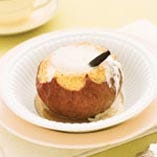 Add vanilla and maple-syrup cream to a classic baked apple and the result is pure confection. To split a vanilla bean open, use a small, sharp paring knife and cut from one tip to the other. Carefully separate the two long, flat sides and scrape the seeds into the dish you're preparing. Save the pods for steeping or grinding to powder, or use them to make vanilla sugar.