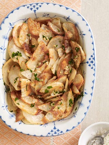 <p>Make a better brunch side dish: Slices of potato are roasted until crispy and golden, then topped with garlic and parsley infused butter and salty pecorino cheese. </p><br />

<p><b>Recipe: <a href="/recipefinder/garlic-potatoes-recipe-clv0511">Garlic Potatoes</a></b></p>