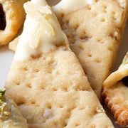 <p>Ginger fans rejoice! These crumbly butter cookies feature ground ginger in the mixture as well as strips of crystallized ginger as a decorative—and tasty—topping.</p>
<p><b>Recipe:</b> <a href="/recipefinder/double-ginger-shortbread-triangles-recipe-122512" target="_blank"><b>Double Ginger Shortbread Triangles</b></a></p>
