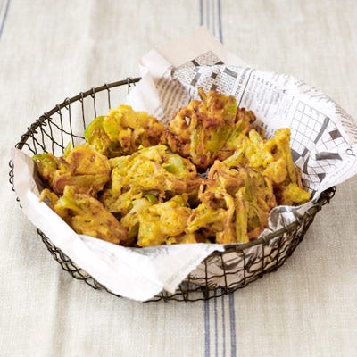 <p>These spicy fried green tomatoes are the creation of Asha Gomez, executive chef-owner of <a href="http://cardamomhill.net/" target="_blank">Cardamom Hill</a> in Atlanta, GA.</p>
<p><strong>Recipe: <a href="http://www.countryliving.com/recipefinder/green-tomato-fritters-recipe-clv0912" target="_blank">Green Tomato Fritters</a></strong></p>
