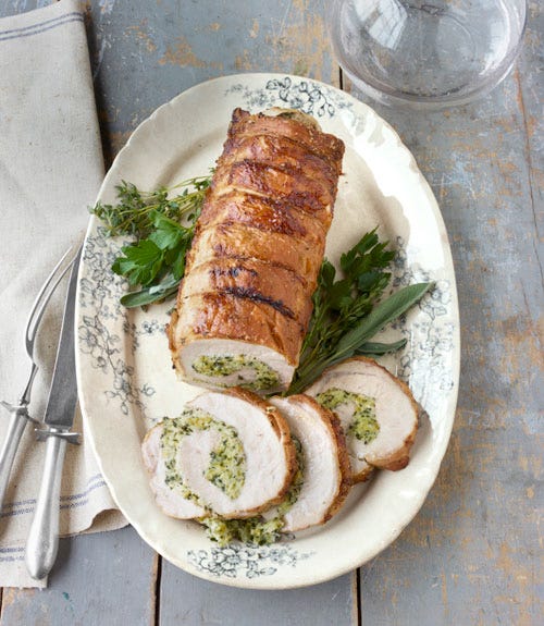 An aromatic brine of juniper, cardamom, and bay imbues this lean cut with juicy flavor; a breadcrumb filling verges on extravagance.
 Recipe: Roast Pork Loin with Herb Stuffing
