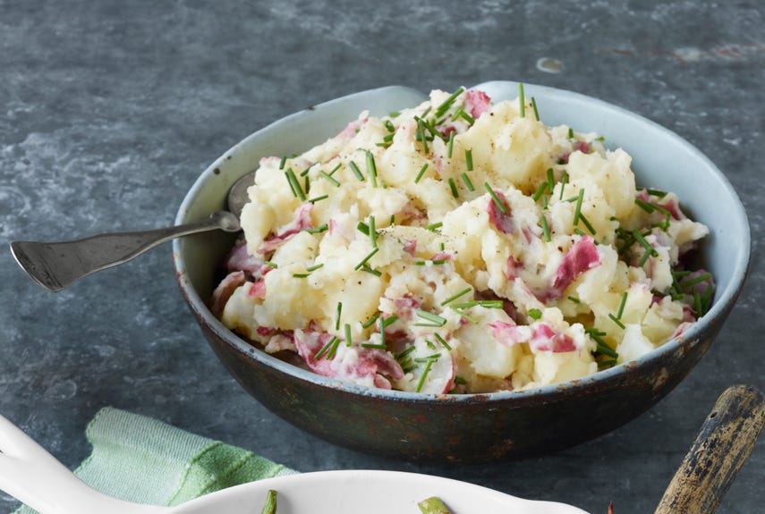 <p>Satisfyingly rustic in texture, these sparingly mashed, skin-on spuds are also rich, thanks to crème fraîche and a few pats of butter.</p>
<p><strong>Recipe:</strong> <a href="http://www.countryliving.com/recipefinder/smashed-red-potatoes-creme-fraiche-recipe-clv0413" target="_blank">Smashed Red Potatoes with Crème Fraîche</a></p>