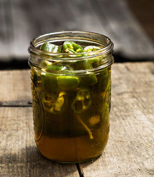 <p>Sweet meets heat in these honey-bourbon-soaked peppers. Instead of fermenting the veggies for a couple weeks, Lee uses vinegar to speed up the process. "Yes, true pickles would keep longer," he admits, "but these are so good, they won't last long anyway."</p>
<p><strong>Recipe:</strong> <a href="http://www.countryliving.com/recipefinder/quick-bourbon-pickled-jalapenos-recipe-clv0513" target="_blank">Quick Bourbon-Pickled Jalapeños</a></p>