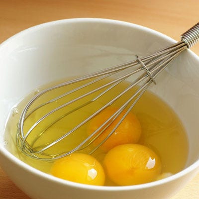 Crack the eggs into a bowl. Beat with a fork or whisk the eggs until they turn a pale yellow color. Add a pinch of salt and fresh black pepper.