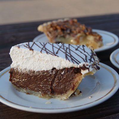 <p><b>Pie Shop:</b> <a href="http://www.lovelesscafe.com/" target="_blank">Loveless Cafe</a></p>
<p><b>Year Opened:</b> 1951</p>
<p><b>Most Popular Pie:</b> All of them!</p> <p>What's the perfect finale to biscuits and fried chicken? Pie, of course! While it's hard to decide which one is truly the standout, the list at the Loveless Cafe includes fudge (pictured), coconut cream, Steeplechase (boubon pecan), and the sinful peanut butter pie in a dark chocolate cookie crust topped with fresh whipped cream. Ready to head to Nashville? If you're not able to get there the Loveless Cafe will be coming out with their first cookbook, <i>Easier Than Pie: Simple Southern Desserts from the Loveless Cafe</i>. We can't wait!</p><br />
<p><b>Try This Recipe:</b> <a href="http://www.delish.com/recipefinder/chocolate-peanut-butter-moon-pies-recipe-fw0910" target="_blank"><b>Chocolate-Peanut Butter Moon Pies</b></a></p>