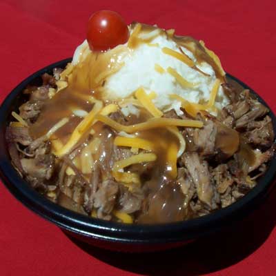 <p><b>Iowa</b> (<a href="http://www.iowastatefair.com/" target="_blank">iowastatefair.com</a>)</p><br /><p>Touted as comfort food at its finest, the hot beef sundae is a generous helping of buttery mashed potatoes surrounded by slow-roasted roast beef and gravy, sprinkled with Cheddar cheese, and garnished with a cherry tomato. It may look like a sundae, but this baby is <i>all</i> Sunday dinner.</p><br /><p>Start your own "sundae" tradition using our recipes for <a href="/recipefinder/sunday-best-roast-beef-pan-gravy-3798" target="_blank"><b>Sunday Best Roast Beef with Pan Gravy</b></a> and <a href="/recipefinder/golden-mashed-potatoes-3726" target="_blank"><b>Golden Mashed Potatoes</b></a>.</p>