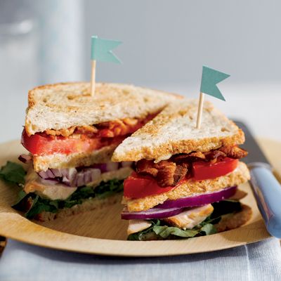 <p>Mouthwatering layers of tender chicken, bacon, beefsteak tomato, and red onion are anchored into this triple-decker sandwich with a generous slathering of tangy mayonnaise. Club sandwiches of this type were also made using chicken salad.</p><br /><p><b>Recipe: <a href="/recipefinder/triple-decker-chicken-sandwich-clv0707" target="_blank">Triple-Decker Chicken Sandwich</a></b></p>