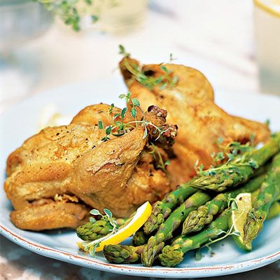 Thanks to a marinade of buttermilk and hot-red-pepper sauce, deep-fried Cornish game hens assume a Southern edge. Steamed asparagus makes a great light, lemony side dish.
 
 Recipes: Southern-Spiced Deep-Fried Game Hen
 Lemon-Dressed Steamed Asparagus