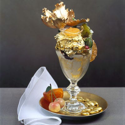 Serendipity 3 Golden Opulence Sundae <b>Where to Buy It:</b> <a href="http://www.serendipity3.com/" target="_blank">Serendipity 3</a><br />
<b>Location:</b> New York, NY<br />
<b>Ingredients:</b> Three scoops of Tahitian and Madagascar vanilla ice cream, 23-carat gold leaves, chunks of rare Chuao chocolate, exotic candied fruits from Paris's Fauchon, chocolate truffles, and a tiny bowl of Grande Passion caviar sweetened with passion fruit, orange, and Armagnac. Topped with a gilded sugar flower and sprinkled with pure 24-carat gold edible dust! Think you can guess how much this indulgent treat costs? Scroll down to find out.<br />
<b>Cost:</b> $1,000 (Guinness Book's
Most Expensive Sundae)<br /><br />
<b>Make Your Own:</b><br />
<a href="/recipefinder/persian-baklava-saffron-caramel-sauce-chopping-block-recipe"target="_new"><b>Baklava with Caramel Sauce and Vanilla Ice Cream</b></a>, <a href="/recipefinder/black-currant-chocolate-truffles-desserts"target="_new"><b>Chocolate Truffles</b></a>