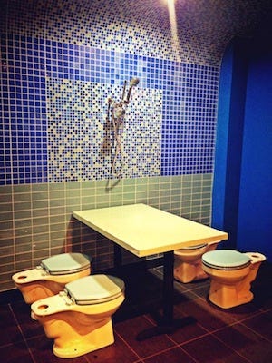 Toilet seat, Purple, Toilet, Room, Plumbing fixture, Wall, Interior design, Ceramic, Porcelain, Flooring, 