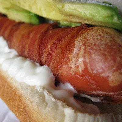 <p>In Puebla, Mexico, street vendors know it's all about the bacon-wrapped hot dog. New York City's <a href="http://cityguides.msn.com/DetailsPage.aspx?ypid=YN618x10552584" target="_blank">Crif Dogs</a> shares the same bacon-centric philosophy. The clandestine hot dog diner serves up five bacon-wrapped wieners including the Good Morning (blanketed in melted cheese and a fried egg), the Tsunami (smothered in teriyaki sauce, pineapple, and green onions), and the Chihuahua (a Mexican classic cushioned by ripe avocados and tangy sour cream).</p>