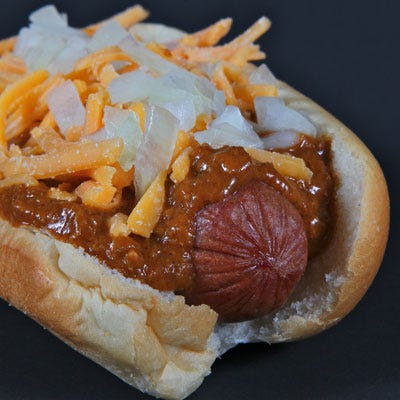 Houston Astros Cincinnati Cheese Coney Dog <p><b>Stadium:</b> <a href="http://houston.astros.mlb.com/hou/ballpark/"target="_blank">Minute Maid Park</a></p>
<p><b>Why It's a Hit:</b> More meat and more spice. More is better in Texas, and the "Cincinnati Cheese Coney Dog" proves it. The jumbo hot dog is enhanced with fiery chili and cheddar cheese, and then topped with diced onion. In addition to the "Cincinnati Cheese Coney Dog," the stadium also offers other dogs representative of states around the nation, like the Georgia Dog (with coleslaw, chopped onions, and barbecue sauce) and the Ken Hoffman New York Dog (with grilled sauerkraut and spicy mustard).</p>
