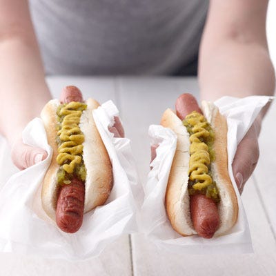 Los Angeles Dodgers Dodger Dog <p><b>Stadium:</b> <a href="http://losangeles.dodgers.mlb.com/la/ballpark/index.jsp"target="_blank">Dodger Stadium</a></p>
<p><b>Why It's a Hit:</b> Have it <i>your</i> way. First off, the Dodger Dog is a foot long, so you won't need to miss an inning for second helpings. Next, Dodger fans decide if they want their pork frankfurter grilled or steamed. The cooked dog is cushioned by a steamed bun with traditional toppings — mustard and relish.</p>