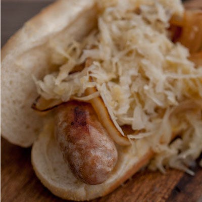 Seattle Marines Cheddar Bratwurst <p><b>Stadium:</b> <a href="http://seattle.mariners.mlb.com/sea/ballpark/index.jsp"target="_blank">Safeco Field</a></p>
<p><b>Why It's a Hit:</b> Locally-sourced. Now heading to the ballpark doesn't mean sacrificing your efforts to eat high-quality, locally-sourced foods. At Safeco, there are several local options you can feel good about, including the Cheddar Bratwurst from Carlton Farms, which is topped with a Sagelands Washington Riesling sauerkraut.</p>