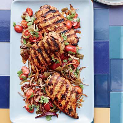 <b>This weekend:</b> Grilling gives foods a great smoky flavor. This recipe takes it up a notch with wood-fired ingredients like smoked paprika and chipotle chiles. Served atop a salad of green chiles, red onions, and grape tomatoes, the chicken gets an extra kick.<br /><br /><b>Recipe:</b> <a href="/recipefinder/harissa-chicken-green-chile-tomato-salad-recipe-fw0610" target="_blank"><b>Harissa Chicken with Green-Chile-and-Tomato Salad</b></a>
