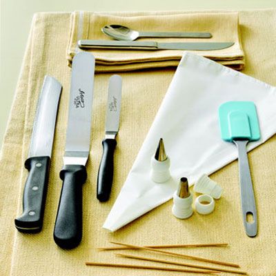 <b>Tips & Tools of the Trade</b><br /><b>1.</b> Slice cakes with a sturdy serrated knife (far left) to ensure a clean cut.<br /><b>2.</b> With their angled blades, large and small offset spatulas (left) make precise frosting easy.<br /><b>3.</b> A basic teaspoon and table knife (top) can stand in for more specialized tools.<br /><b>4.</b> A canvas or disposable plastic pastry bag with couplers and tips in assorted sizes (middle) is a must-have for piping dots, lines, and swirls.<br /><b>5.</b> Stir batter with a rubber spatula (right).<br /><b>6.</b> Use long, thin bamboo skewers (bottom) to stabilize cake layers, if necessary.<br /><br />Find these and other essential baking supplies at <a href="http://www.atecousa.net" target="_blank">atecousa.net</a>.<br /><br /><b>NO PASTRY BAG? NO WORRIES</b><br />In a pinch, Karen recommends using a freezer-weight ziplock plastic bag in place of a traditional pastry bag. Cut a small hole in one of the bag's bottom corners, then fit with a coupler and tip, fill halfway with icing, and seal.
