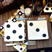 Score big at your next game night with these fun appetizer plates. Use two at each setting to replace a normal-sized plate. Continue the casino and gaming theme with matching geometric napkins. Not all casinos are created equal: Make sure yours is five stars with small votives and reed place mats.