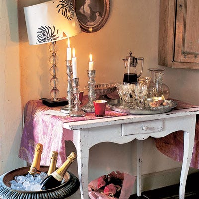 Beverages can be self-serve. Set them atop a side table or desk, and if you want more room, nestle bottles of Prosecco or ginger ale in a garden urn filled with ice.