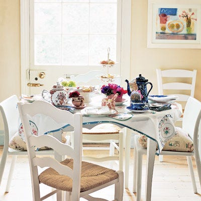 On a Sunday afternoon, few things lift spirits like a good cup of tea. Pair it with friends and you have a party sure to send all home content and merry. A printed-paper tablecloth with coordinating printed napkins lends the table busy English cheer.