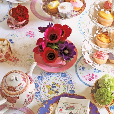 Play up the look with mismatched china cups, more than one teapot, posies from the garden, and cupcakes frosted in a multitude of floral hues. The medley of color and pattern is easy to assemble even if you don't own a lot of dishes. Visit a flea market — and if you can't, call your Mum.