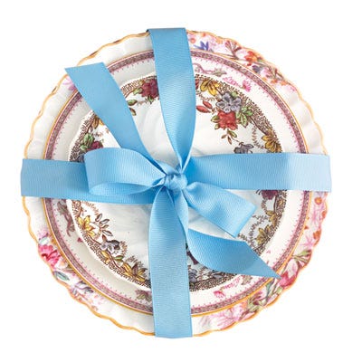 <b>Personalize it:</b> Even if your daughter or granddaughter doesn't share your love for vintage dishware, it's likely she'd happily don jewelry made with repurposed china in her own pattern. Try <a href="http://www.vintagerevival.com"target="_blank">vintagerevival.com</a> for inspiration and gift ideas.<br /><br />
<b>Sweet combinations:</b> Plates don't have to match to look pretty as a place setting. Focus on borders, combining geometric designs with floral ones, and include at least one plate with a scalloped or gilded edge. Secure with a color-coordinated grosgrain ribbon.