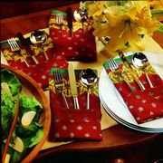 <p>Napkin and flatware are artfully
presented together in this clever fold.</p><br />