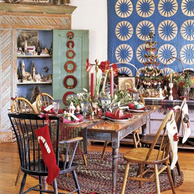 <p>Stockings decorate the chairs, and wrapped gifts act as both favors and place cards in this display.</p>