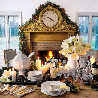 <p>This golden mantel clock trimmed with a holiday garland is a striking backdrop for a crisp white dinnerware arrangement.</p>