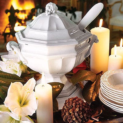 <p>Sitting pretty amid candle pillars, amaryllis blossoms, and magnolia leaves: a soup tureen found at a flea market.</p>