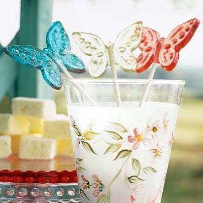 <p>Sparkling brightly, these lemon-, cherry-, and orange-flavored butterfly lollipops flutter over a painted tumbler. Make them to-go treats by wrapping each pop in clear cellophane and tying a ribbon underneath the candy top.</p><br /><br /><p><a href="/recipefinder/colorful-flavored-lollipops-3690" target="_blank"><b>Get this recipe!</b></a></p>