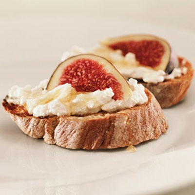 Serve chic appetizers, like this ricotta and fig bruschetta. Slice a baguette, brush pieces with melted butter, and place them under the broiler until golden. Spread ricotta over the toasted bread, drizzle with wildflower or orange-blossom honey, top with a slice of ripe fig or fresh peach, nectarine, or plum, then serve.