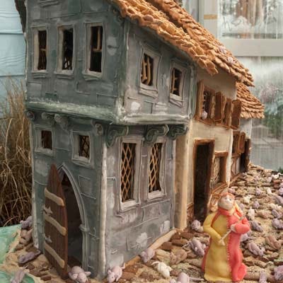 <p><b>Location:</b> The New York Botanical Garden's 2009 Gingerbread Adventures (Bronx, NY)</p>
<p>The mother-daughter duo behind Ardsley, New York's Riviera Bake House took inspiration from daughter Liv Hansen's favorite childhood fairytale to create their 2-foot tall structure. No candy was used to decorate; Liv instead completed detail work using a pipeable, watered-down recipe for gingerbread. She sculpted all of the mice and the Pied Piper from marzipan, and constructed the roof from cereal. The team dedicated five days to the project, using approximately 10 pounds of gingerbread and 2 to 3 gallons of icing.</p>